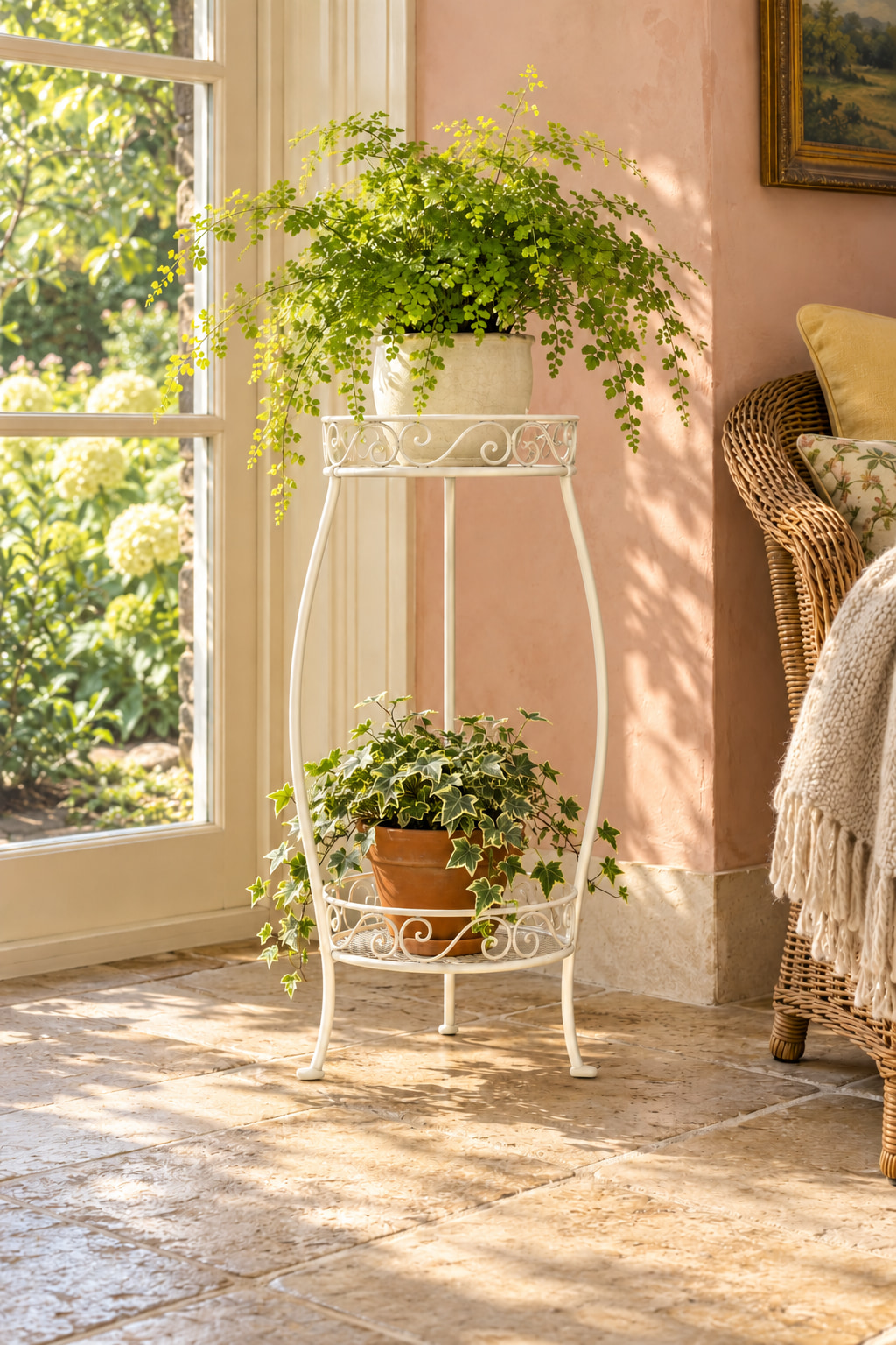 Illustrated pink garden-room corner with a fern and trailing ivy on a white two-tier scrollwork plant stand. Sunlight crosses the stone floor beside a garden-facing glazed door and wicker chair.