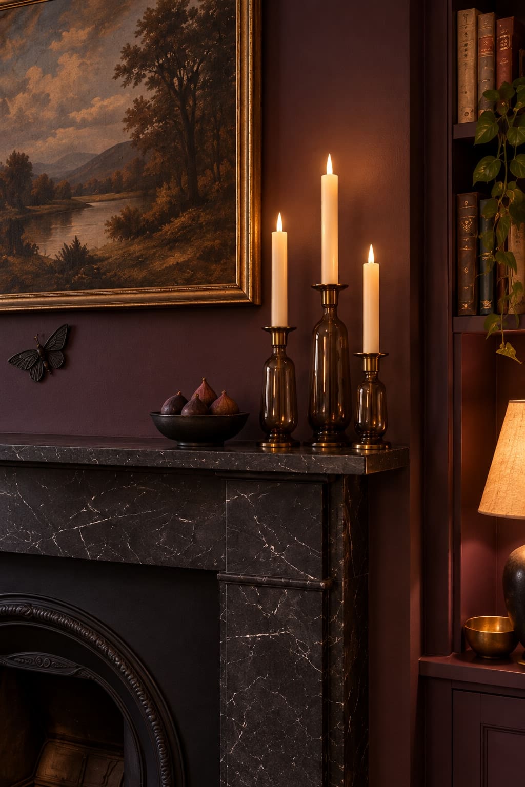 Smoke-coloured glass, figs and a paper moth beside the landscape. The fireplace stays unlit.