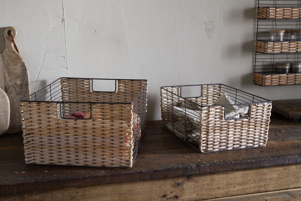 Two Nkuku Montali wire-and-rattan storage baskets with inset handles, shown in the retailer photograph.