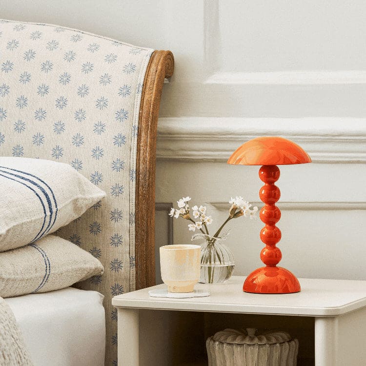 Orange portable bobbin lamp, retailer photograph
